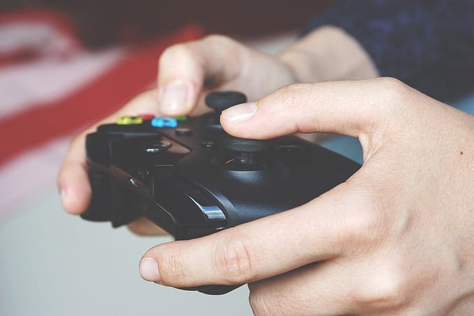 boy playing Xbox Racing Pro